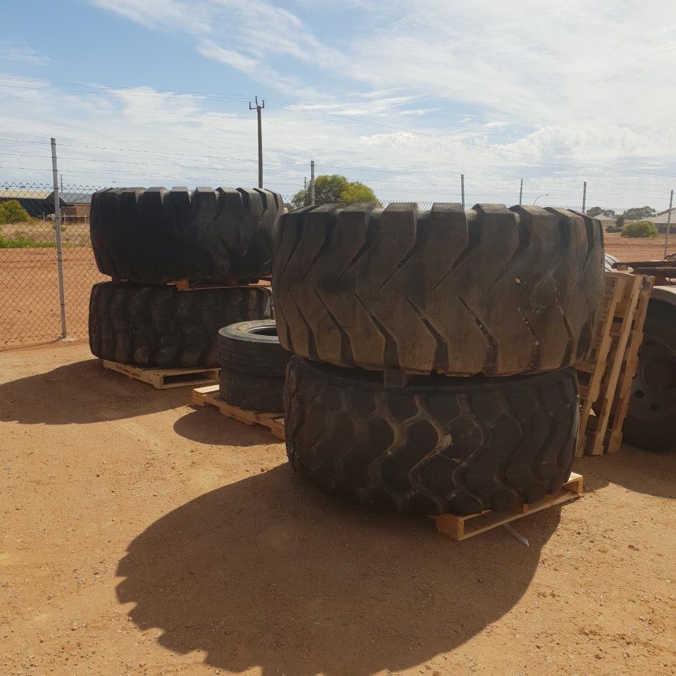 a stack of four R25 Earth Moving Tyres